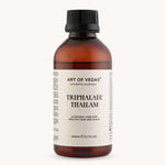 Bottle of Art of Vedas Triphaladi Thailam on a white background